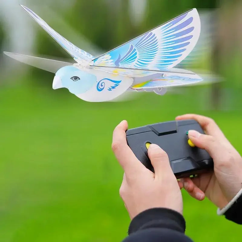 Electronic Flying Bird Drone Toy, Adjust the Rudder to Make the Flapping Wings Bird Fly, Mini RC Drone Helicopter 235x275x70mm 360 Degree Flying RC Bird Toys Remote Control E-Bird2.4 GHz - Toyigo